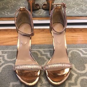 Strappy rose gold Aldo sandals.